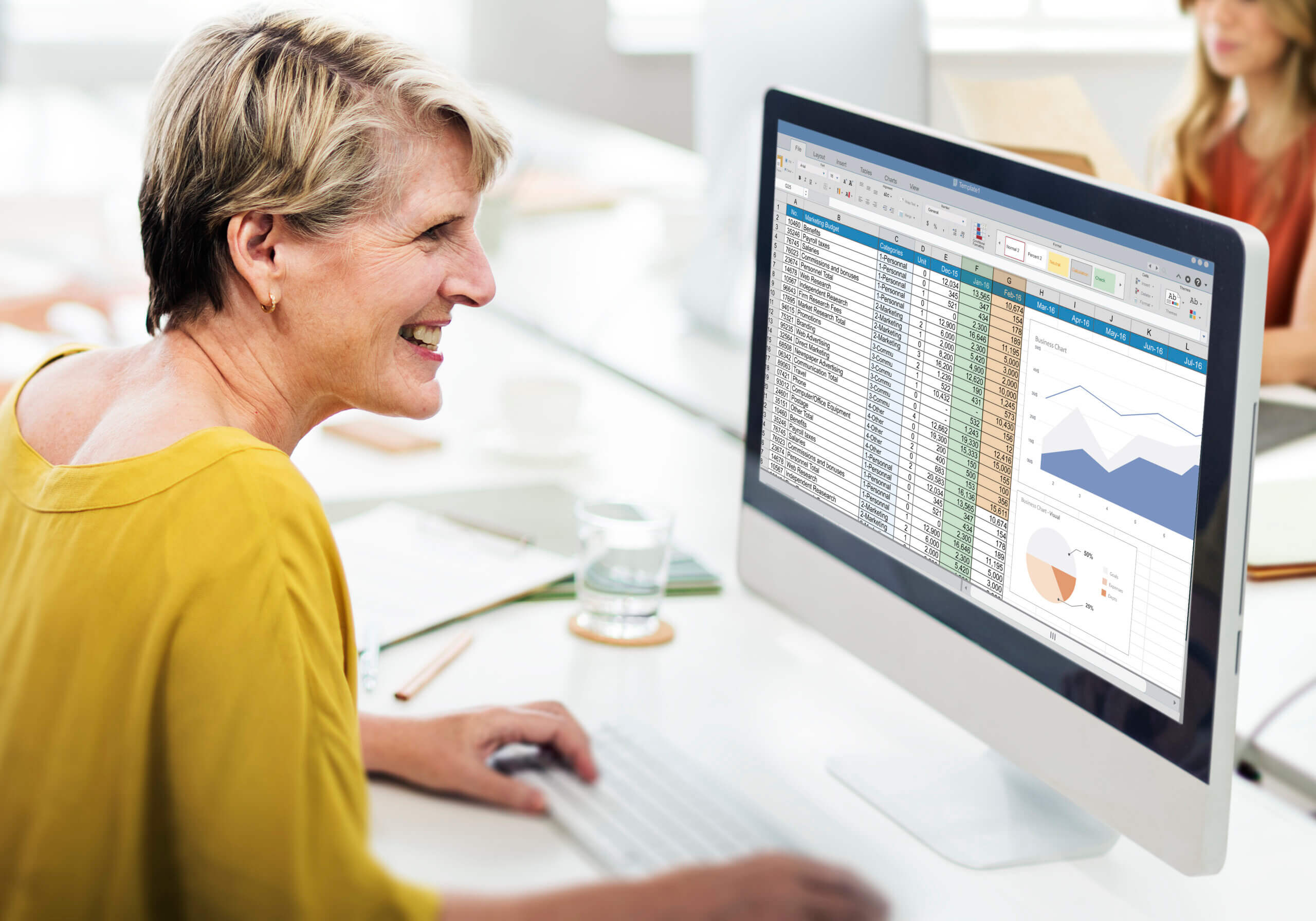 Woman making a spreadsheet on her computer