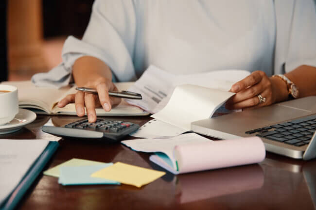 payroll person working with bills