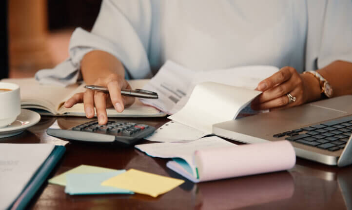 payroll person working with bills