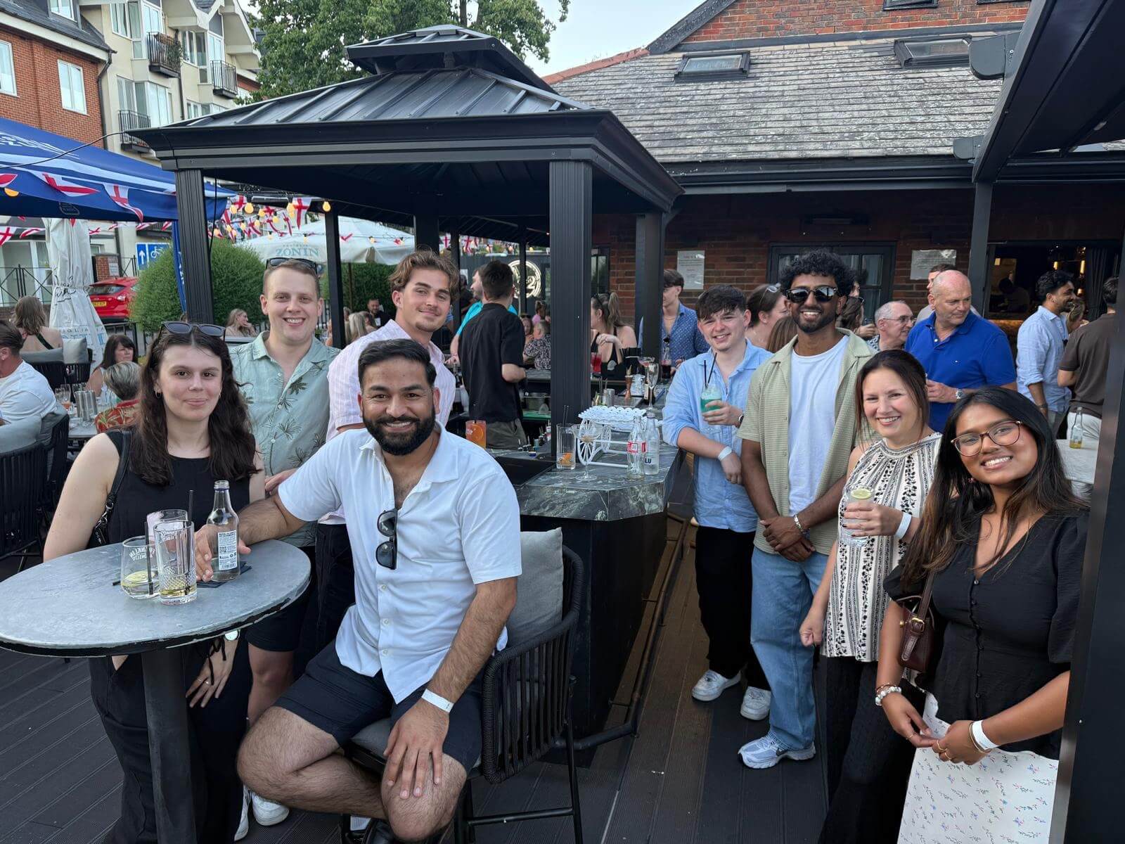 Our team getting together for summer drinks and bbq and enjoying the evening.