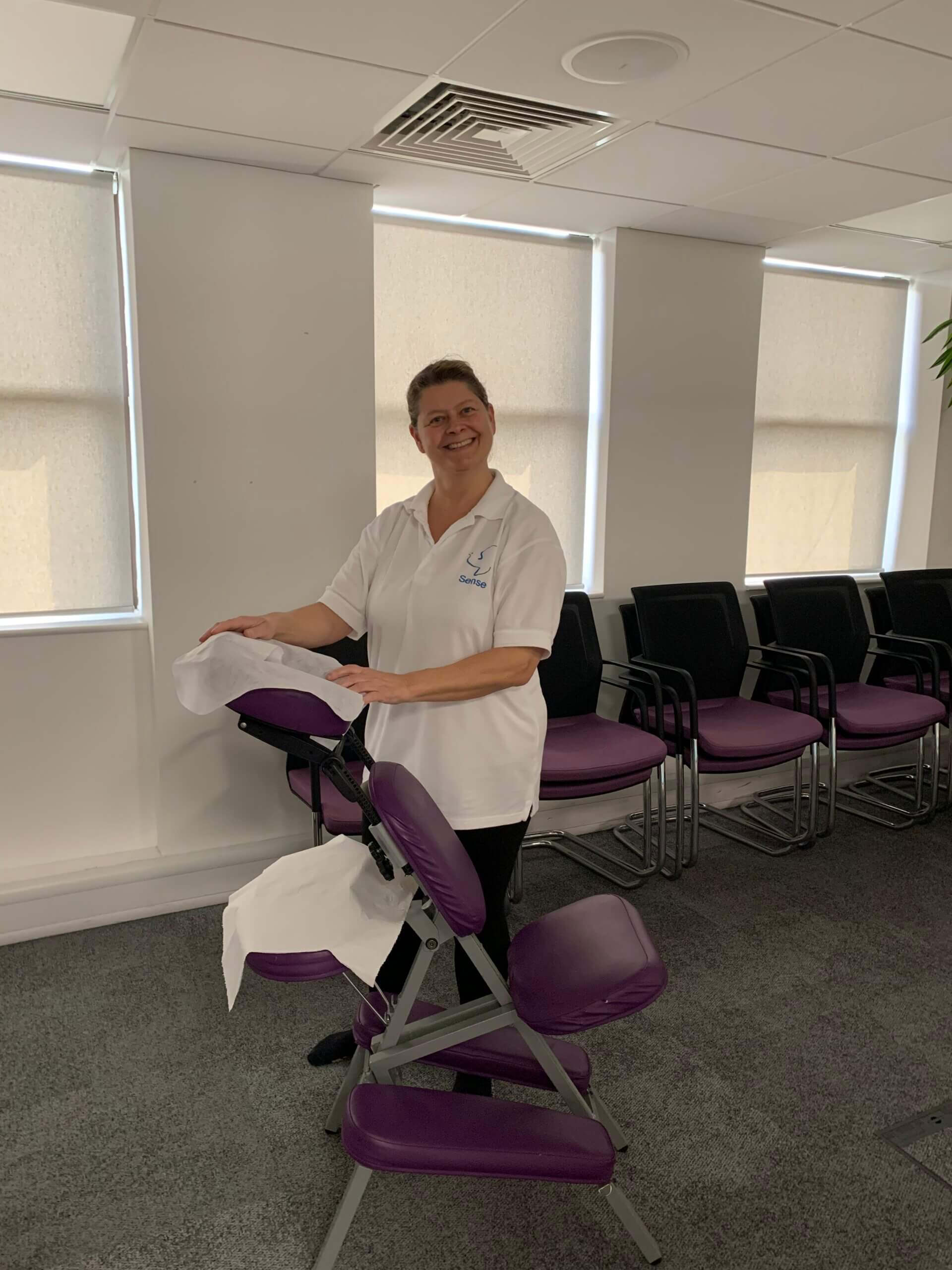 A massage therapist spoiling our team with an office massage.